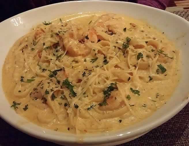 Crawfish fettuccine served on a white plate ... beautiful!
